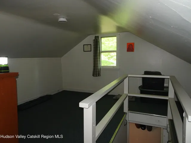 a view of a bedroom with furniture and staircase