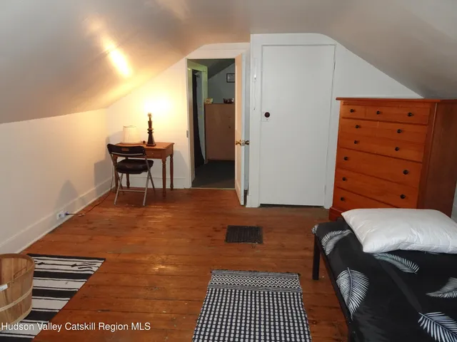 a room with furniture and air conditioner