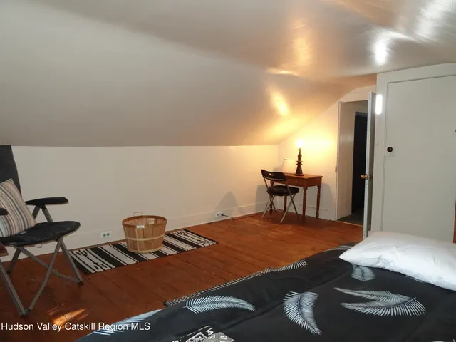 a dining room with a table and chairs