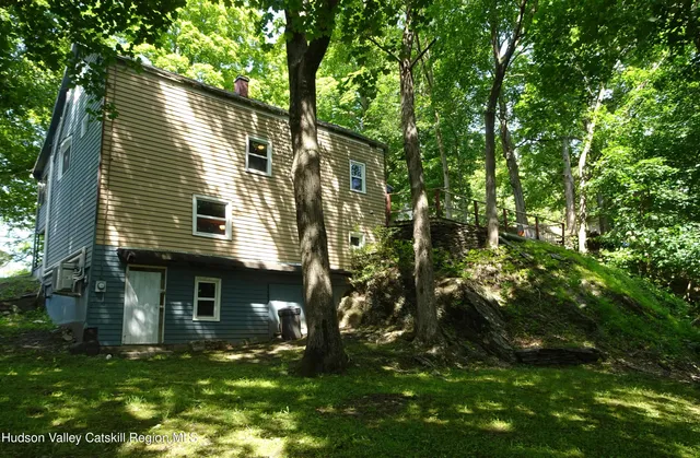 a view of roof deck with wooden floor and seating space
