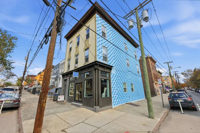 a view of a brick building with many windows