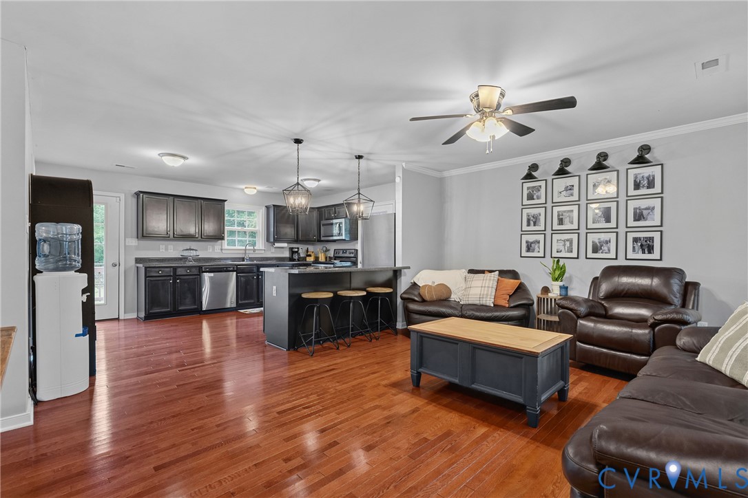 Hardwood flooring throughout, kitchen featuring da