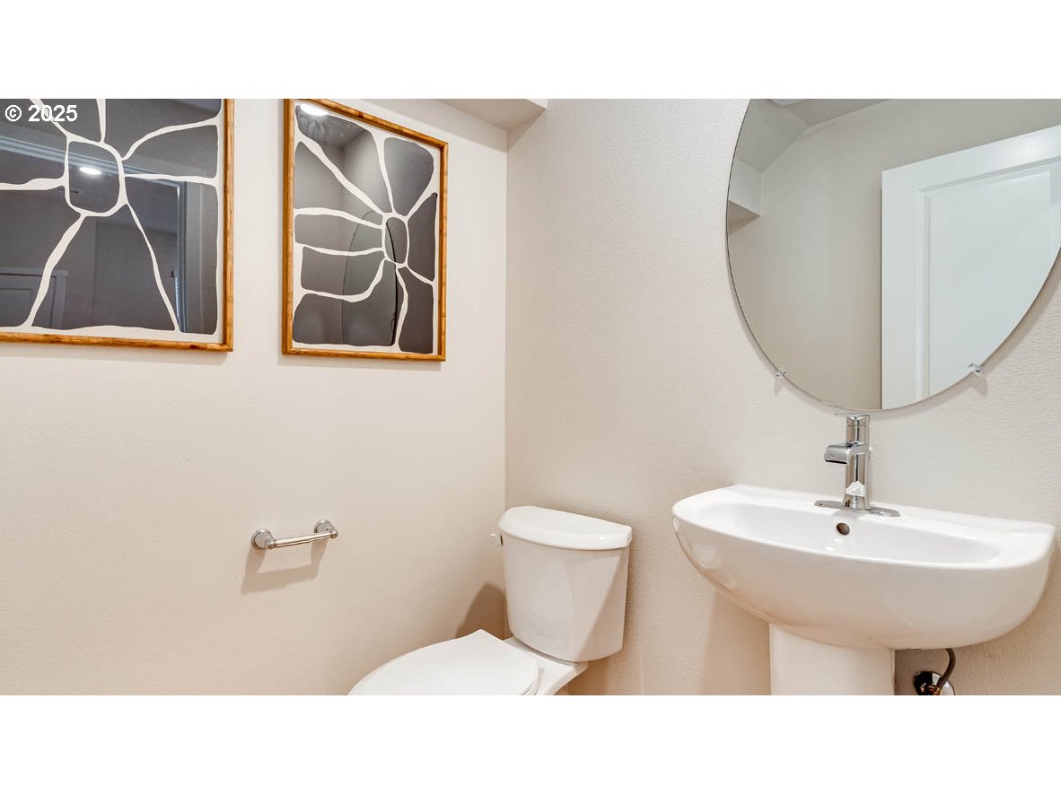 2170 36th Avenue Forest Grove, OR 97116 - Photo 3 of 28 a bathroom with a sink and a mirror