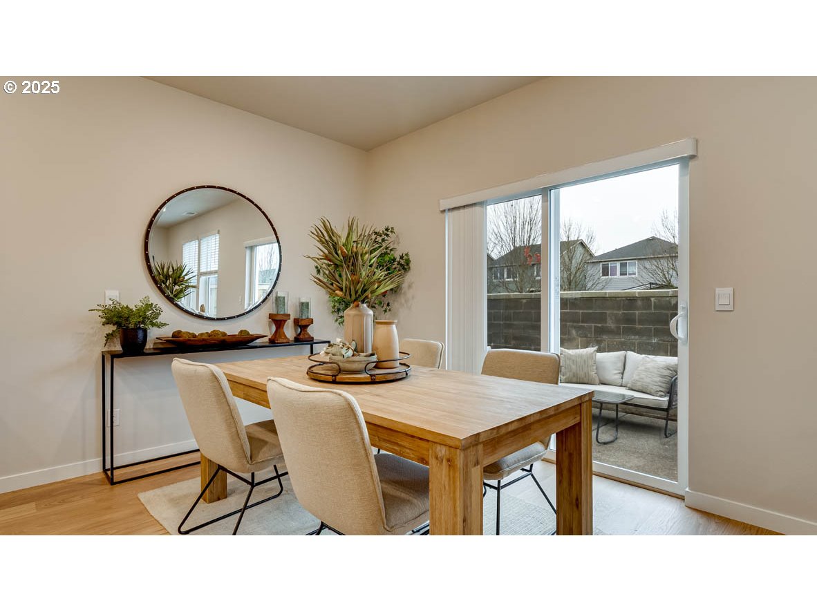 2170 36th Avenue Forest Grove, OR 97116 - Photo 7 of 28 a living room with a table a table and a potted plant