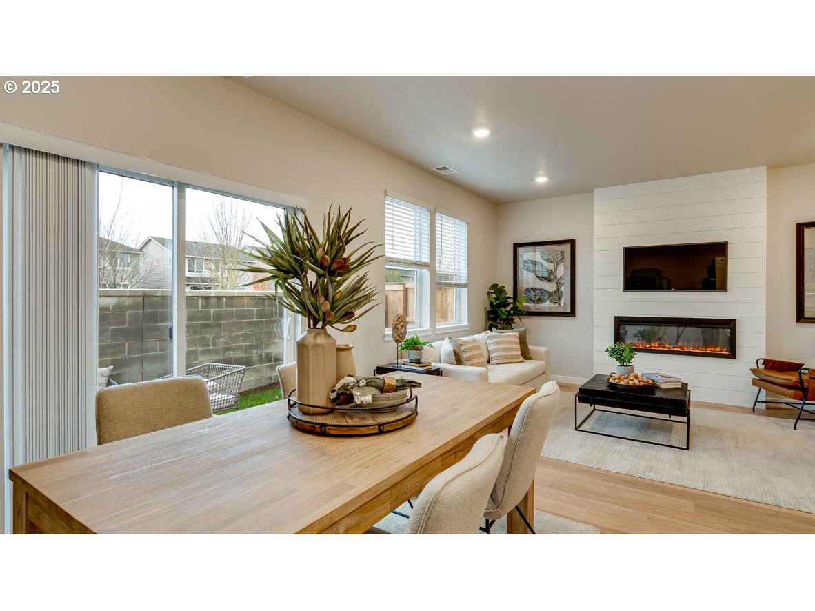 2170 36th Avenue Forest Grove, OR 97116 - Photo 8 of 28 a living room with furniture a flat screen tv and a large window