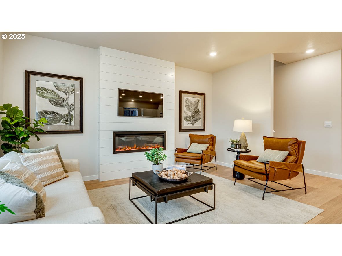 2170 36th Avenue Forest Grove, OR 97116 - Photo 9 of 28 a living room with furniture and a fireplace