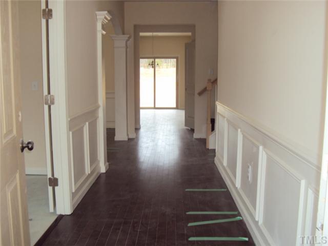 2333 Everstone Road Wake Forest, NC 27587 - Photo 3 of 20 Hardwoods, crown moulding and beautiful trim detail offer an impressive entrance!