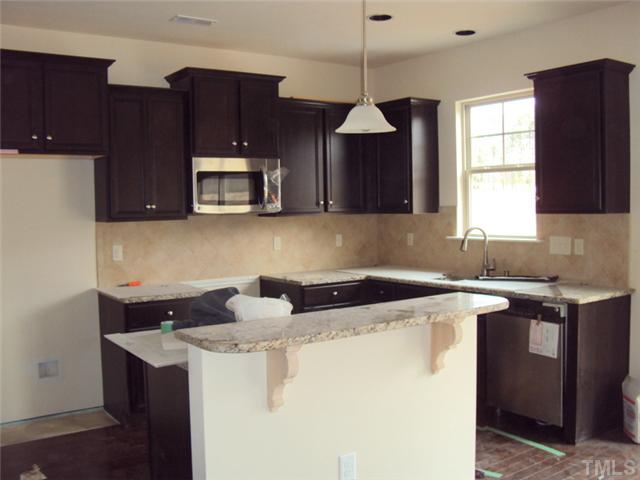 2333 Everstone Road Wake Forest, NC 27587 - Photo 6 of 20 Granite countertops and tile backsplash just installed!