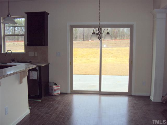 2333 Everstone Road Wake Forest, NC 27587 - Photo 7 of 20 with slider that opens to patio and spacious, flat backyard!