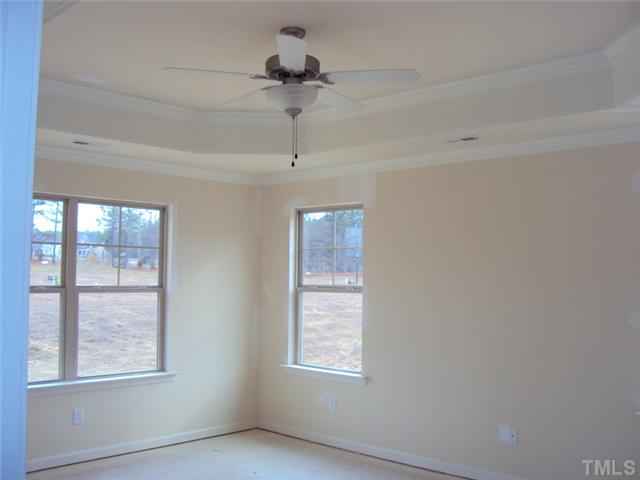 2333 Everstone Road Wake Forest, NC 27587 - Photo 9 of 20 features an octagonal trey ceiling with crown moulding and trim detail for a beautiful finish!