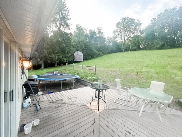 a view of a lake with chairs