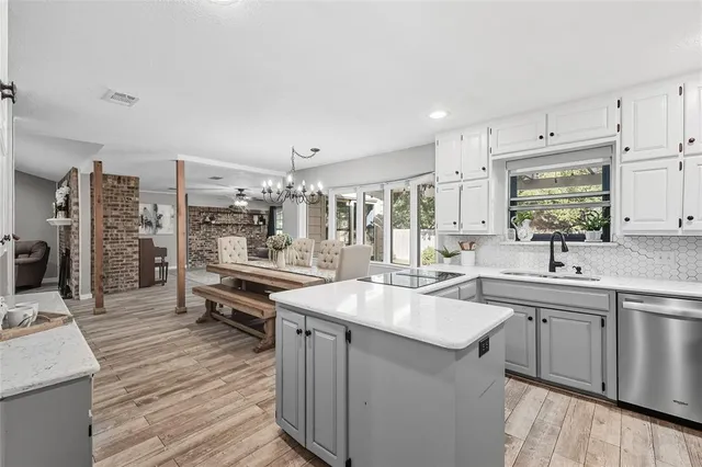 a kitchen with lots of counter space and sink