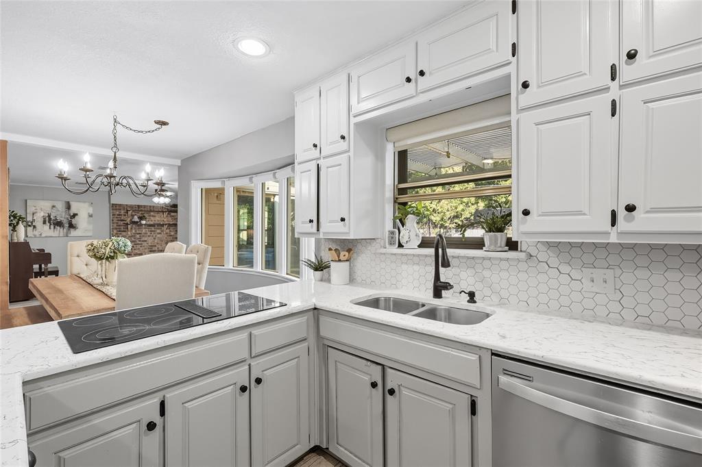 2908 Steve Drive Hurst, TX 76054 - Photo 19 of 40 a kitchen with a sink and cabinets