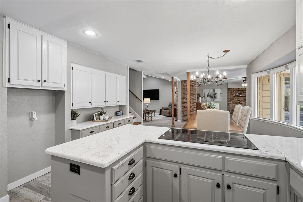 2908 Steve Drive Hurst, TX 76054 - Photo 20 of 40 a kitchen with a stove refrigerator and cabinets