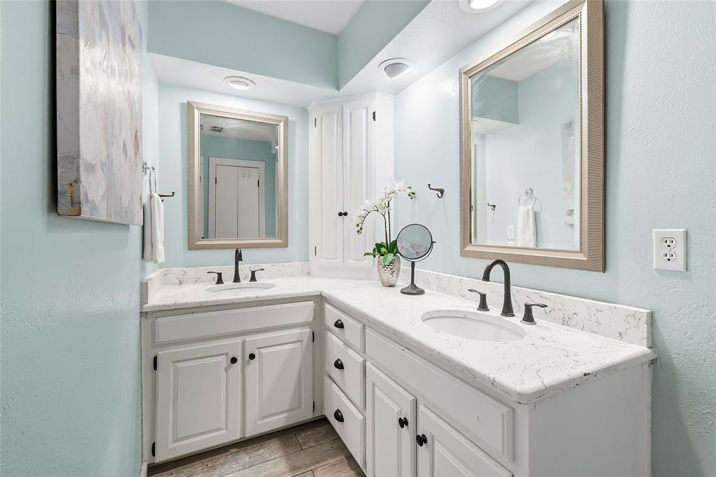2908 Steve Drive Hurst, TX 76054 - Photo 25 of 40 a bathroom with double sink and two mirror