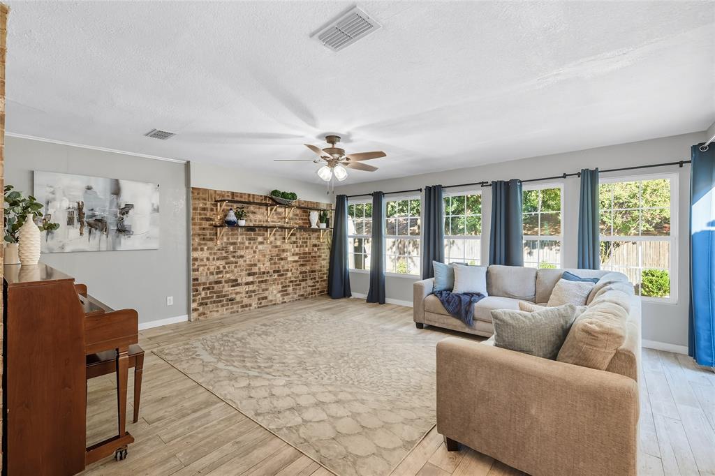2908 Steve Drive Hurst, TX 76054 - Photo 9 of 40 a living room with furniture and a large window