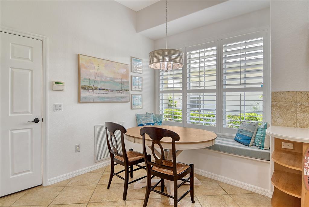 340 Bermuda Court, Unit 5 Venice, FL 34293 - Photo 11 of 52 a dining room with furniture and window