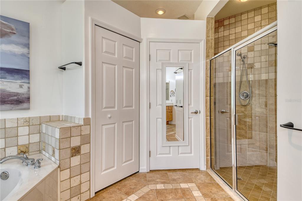 340 Bermuda Court, Unit 5 Venice, FL 34293 - Photo 24 of 52 a bathroom with a tub shower and sink