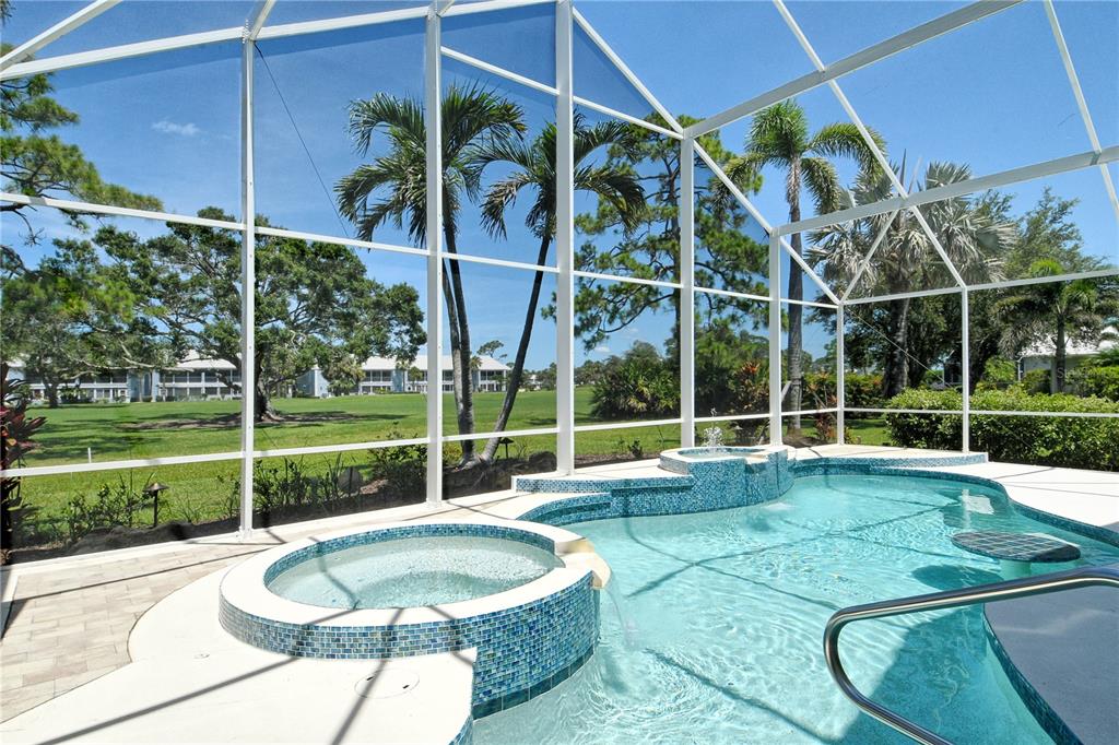 340 Bermuda Court, Unit 5 Venice, FL 34293 - Photo 37 of 52 a view of a backyard with swimming pool and porch