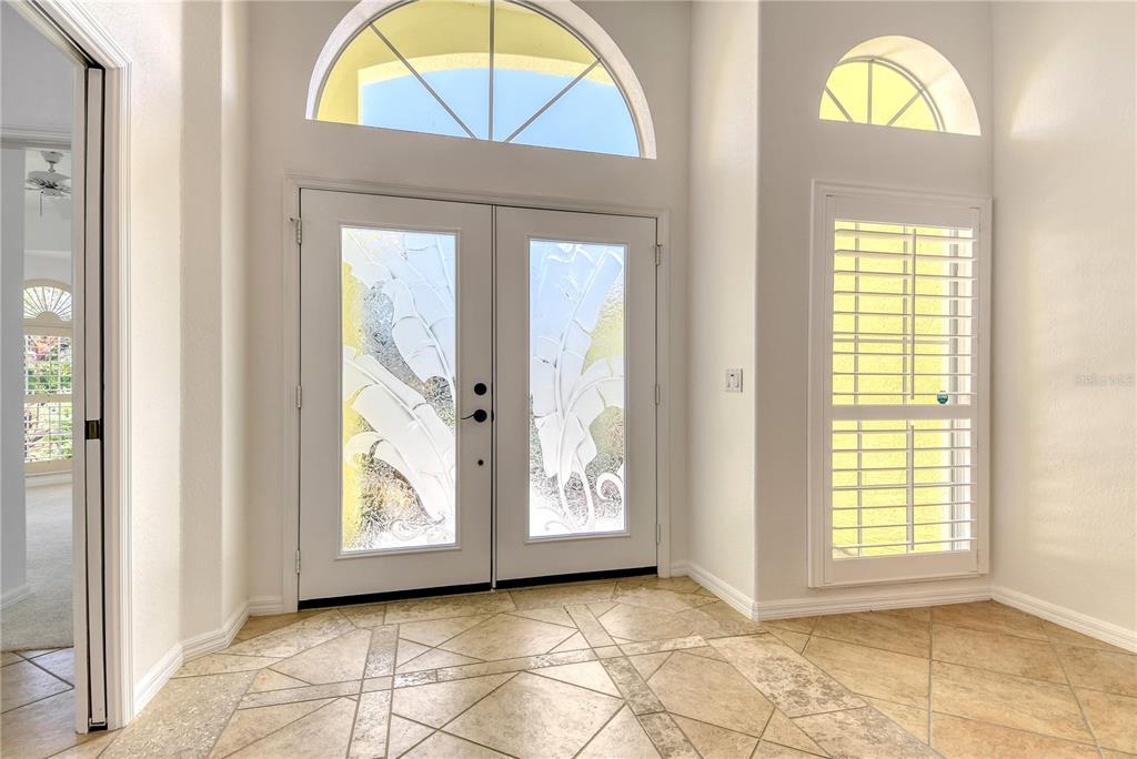 340 Bermuda Court, Unit 5 Venice, FL 34293 - Photo 5 of 52 a view of an entryway with a window