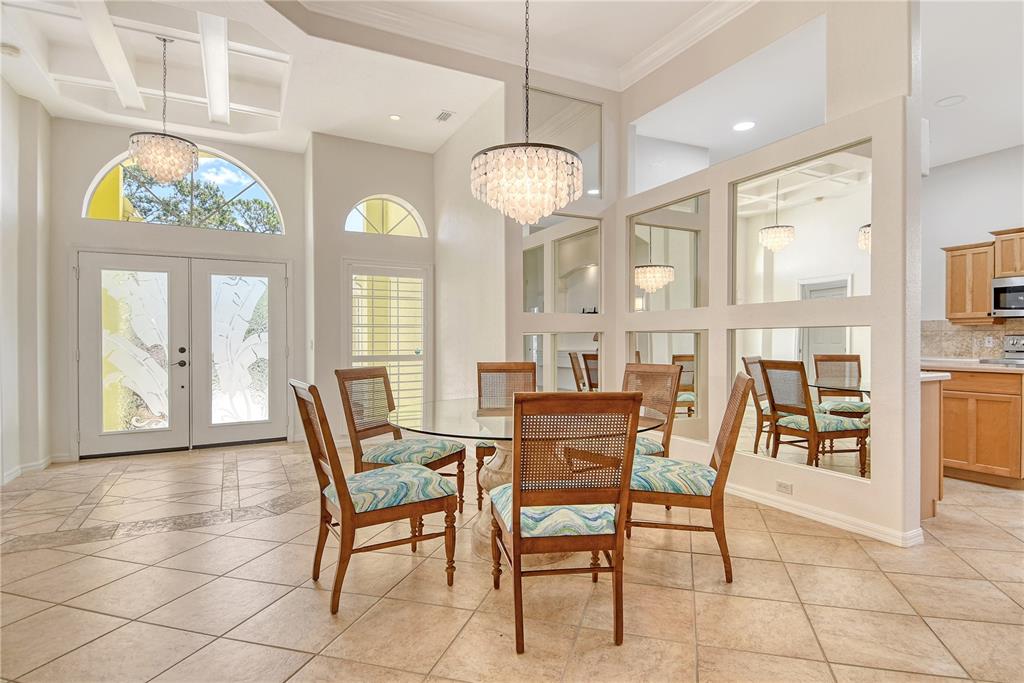 340 Bermuda Court, Unit 5 Venice, FL 34293 - Photo 6 of 52 a view of a dining room with furniture and chandelier
