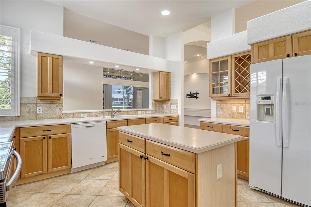 340 Bermuda Court, Unit 5 Venice, FL 34293 - Photo 9 of 52 a kitchen with stainless steel appliances granite countertop a sink and cabinets