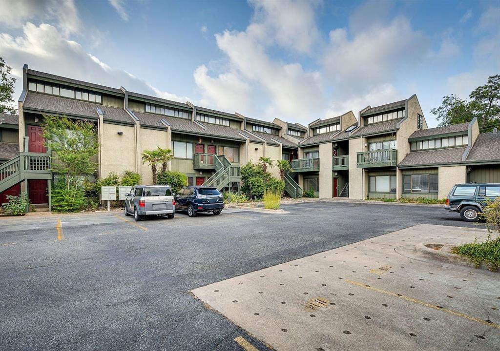 a view of a car park in front of house