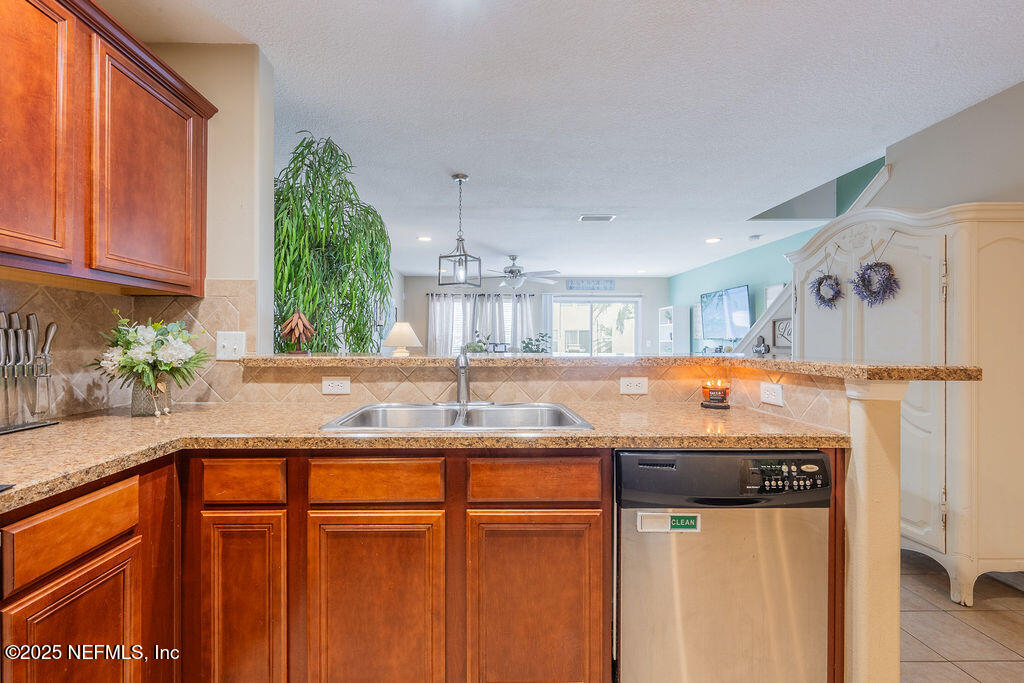 160 Crete Court St. Augustine, FL 32084 - Photo 13 of 33 a kitchen with stainless steel appliances granite countertop a sink and a cabinets