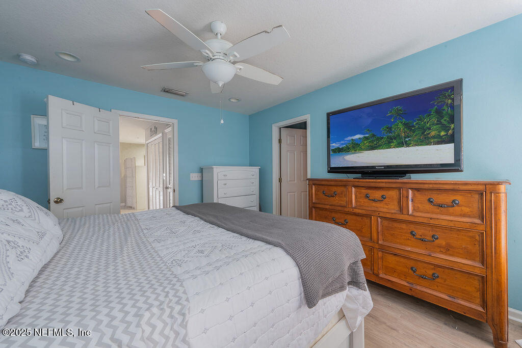 160 Crete Court St. Augustine, FL 32084 - Photo 16 of 33 a bedroom with a bed and a flat screen tv