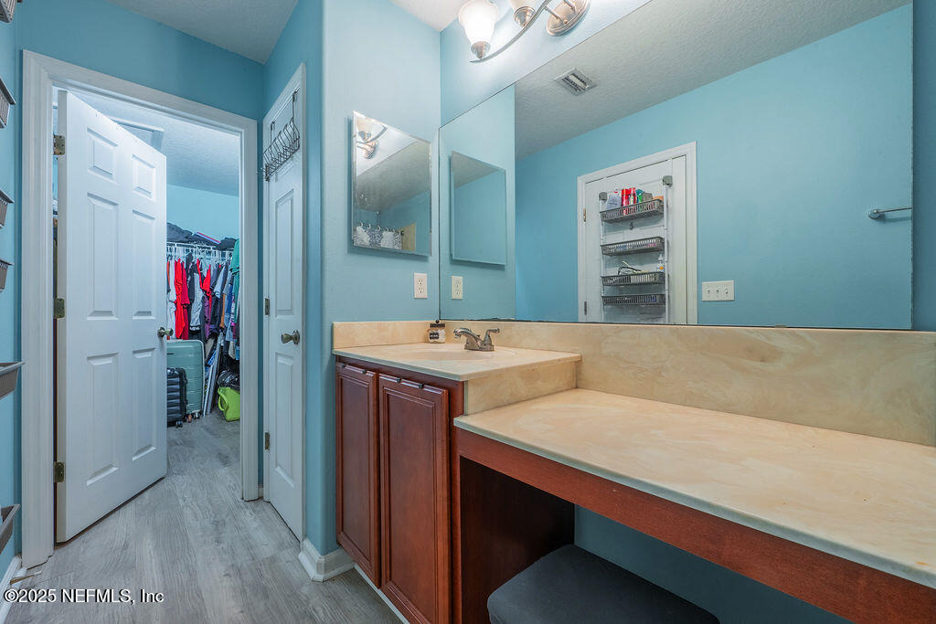 160 Crete Court St. Augustine, FL 32084 - Photo 18 of 33 a bathroom with a sink and a mirror