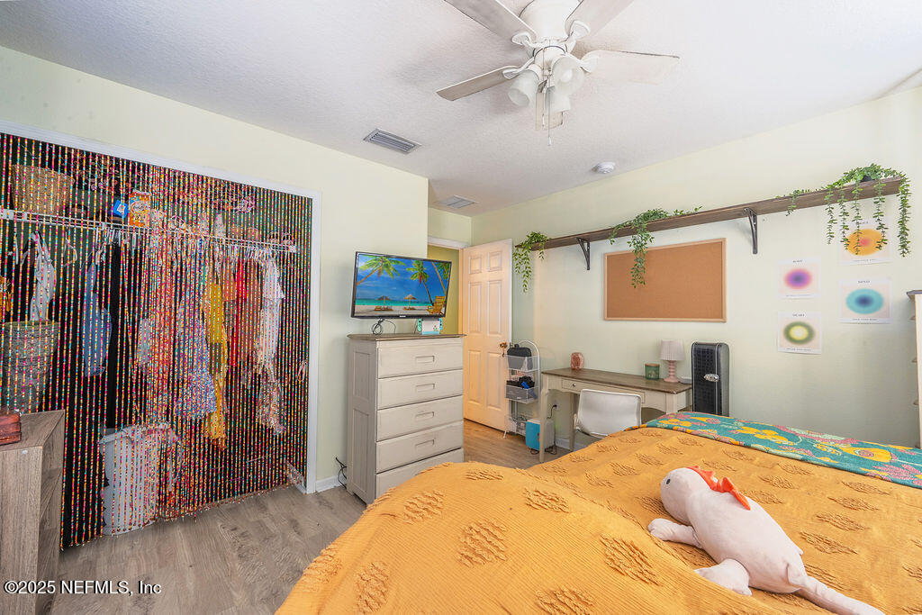 160 Crete Court St. Augustine, FL 32084 - Photo 20 of 33 a bedroom with a bed dresser and a window