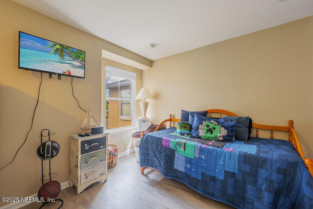 160 Crete Court St. Augustine, FL 32084 - Photo 23 of 33 a bed room with furniture and a window