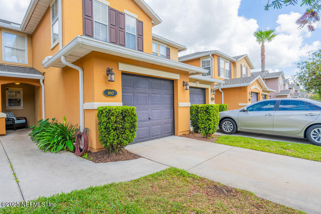 160 Crete Court St. Augustine, FL 32084 - Photo 25 of 33 a front view of a house with garden