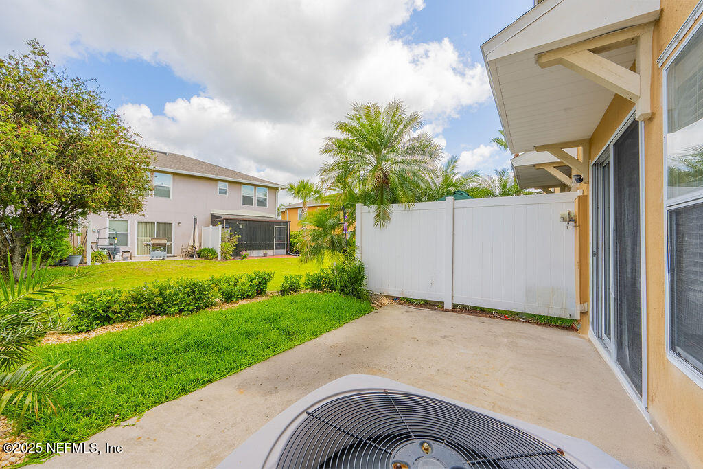 160 Crete Court St. Augustine, FL 32084 - Photo 29 of 33 a front view of a house with a yard and garage