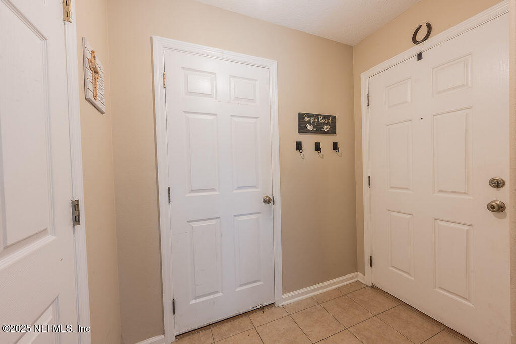 160 Crete Court St. Augustine, FL 32084 - Photo 4 of 33 a view of an entryway with wooden floor