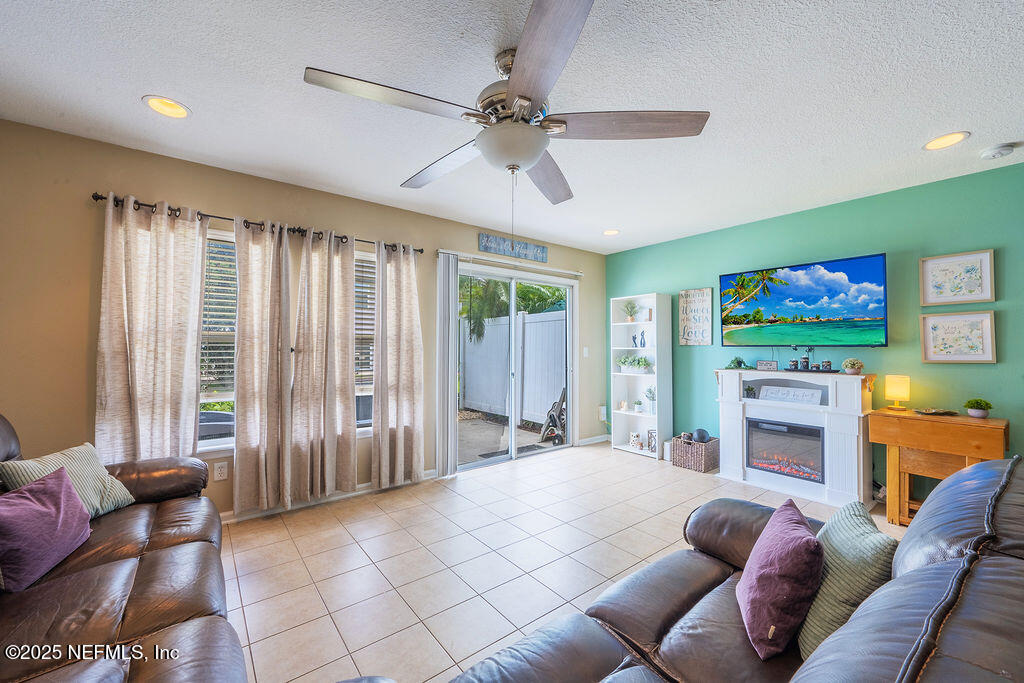 160 Crete Court St. Augustine, FL 32084 - Photo 9 of 33 a living room with furniture and a flat screen tv