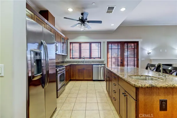 a kitchen with stainless steel appliances granite countertop a stove and a microwave