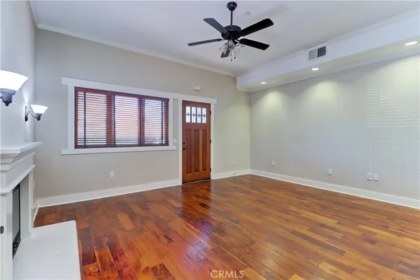 a view of a dining area with furniture and wooden floor