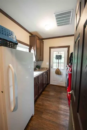 a kitchen with a refrigerator a sink and dishwasher