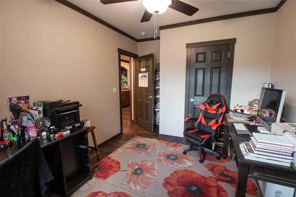 a bedroom with furniture and a window