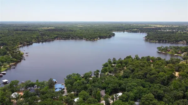 an aerial view of a houses with a lake view