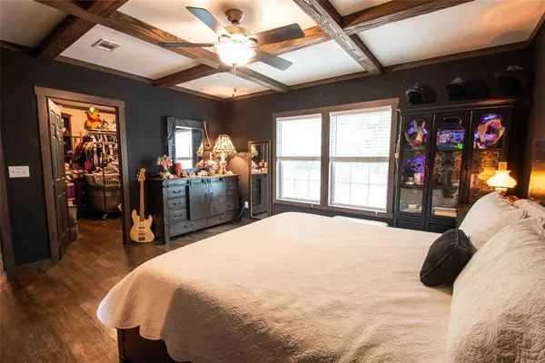 a bed room with a bed and a large window