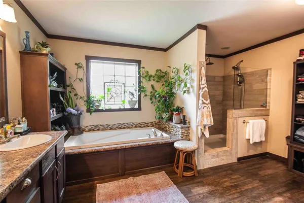 a spacious bathroom with a bathtub and a sink