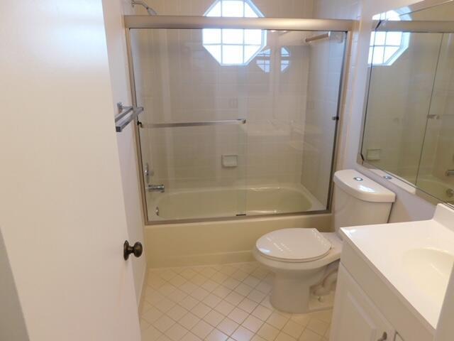 6630 Via Regina Boca Raton, FL 33433 - Photo 14 of 24 a bathroom with a toilet and a shower