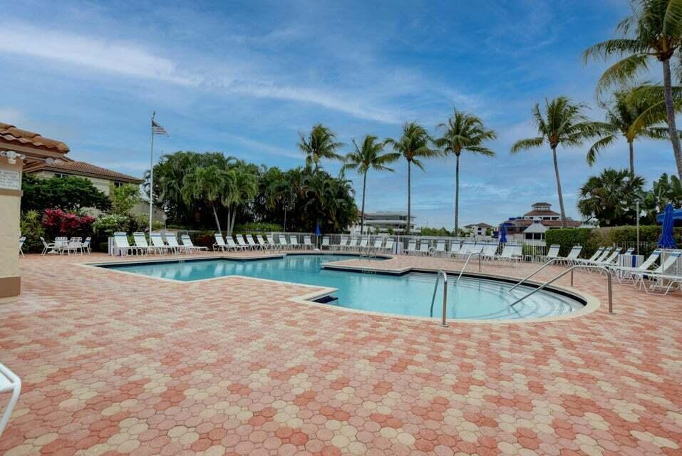 6630 Via Regina Boca Raton, FL 33433 - Photo 23 of 24 a view of a swimming pool with an outdoor seating
