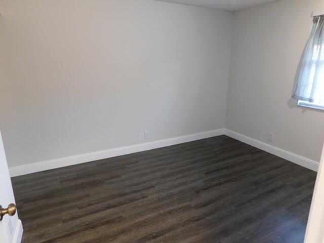 6630 Via Regina Boca Raton, FL 33433 - Photo 9 of 24 a view of an empty room with wooden floor and a window