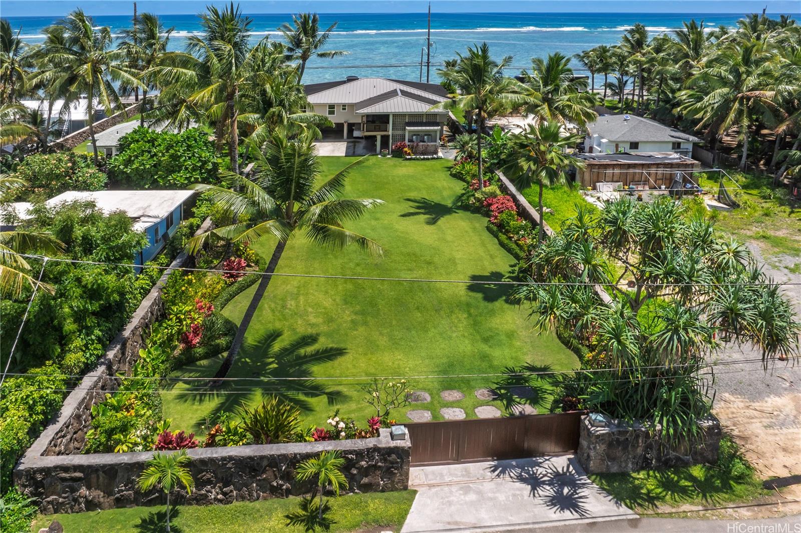 53-014 Makao Road, Unit F Hauula, HI 96717 - Photo 2 of 6 an aerial view of a house with a yard