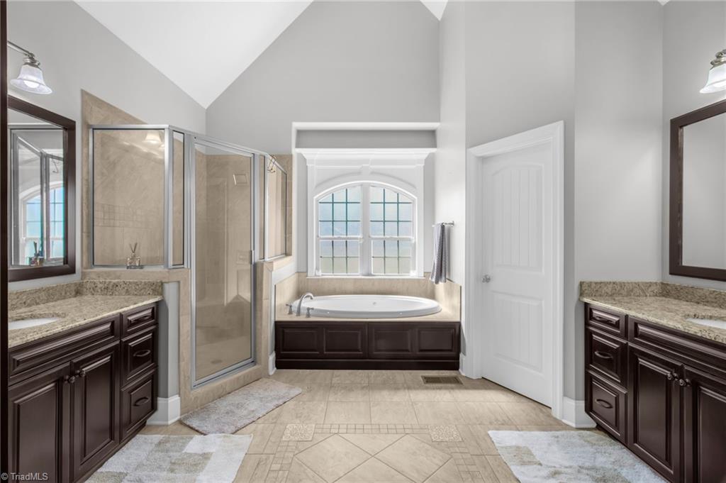 8174 Rob Roy Drive Summerfield, NC 27358 - Photo 17 of 47 Primary bath with vaulted ceiling