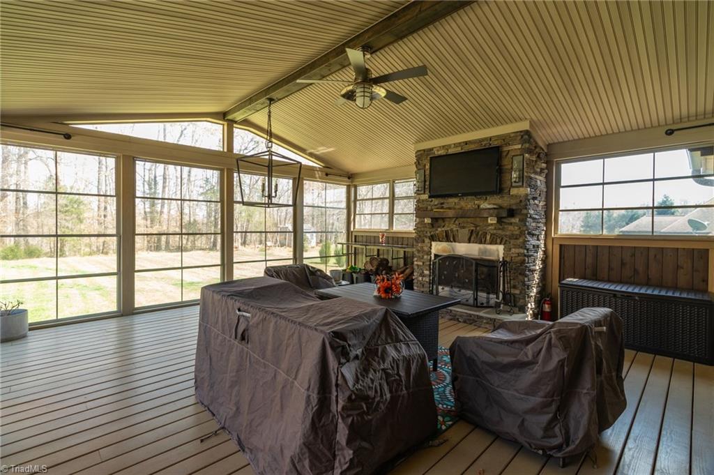 8174 Rob Roy Drive Summerfield, NC 27358 - Photo 34 of 47 Screened porch with wood burning fireplace