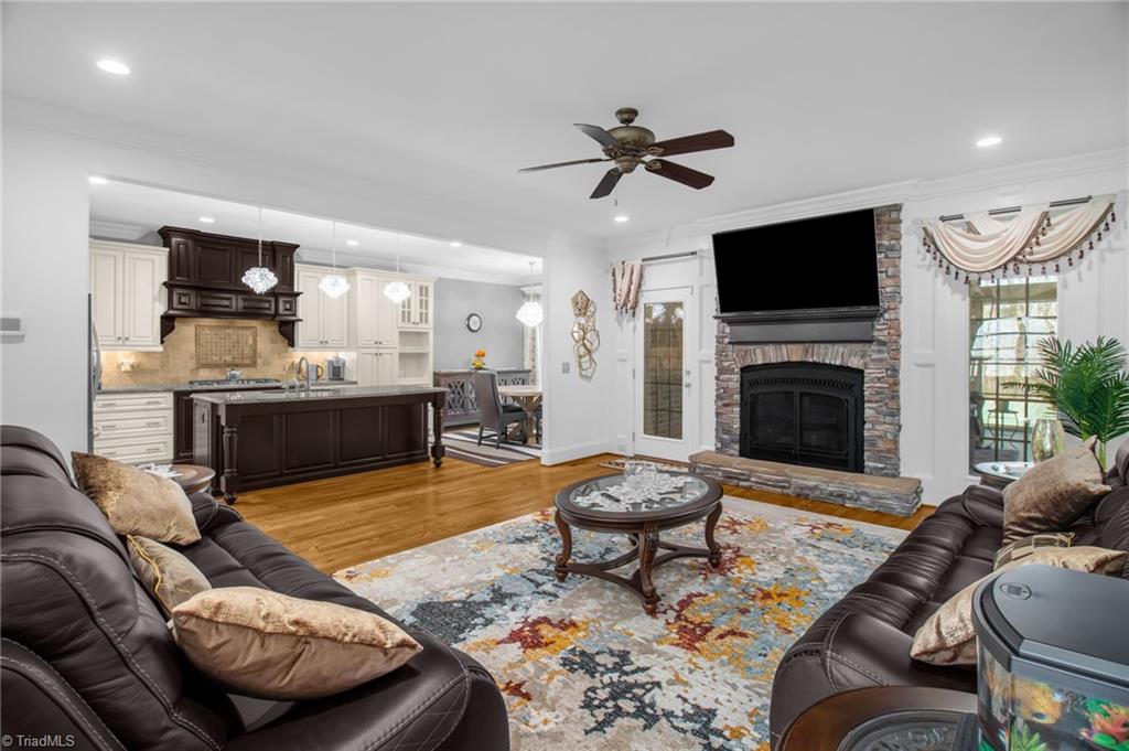 8174 Rob Roy Drive Summerfield, NC 27358 - Photo 5 of 47 Living room with gas fireplace